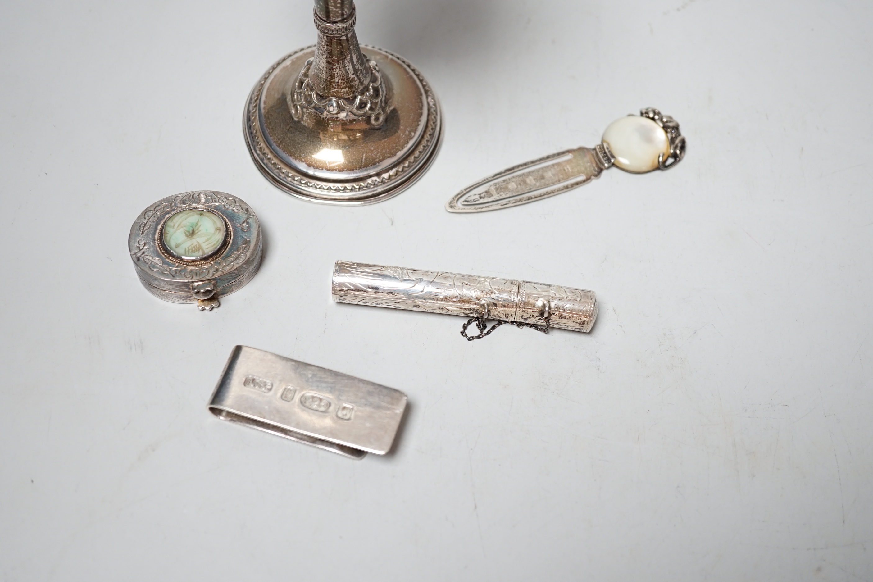 A 1960's silver and turquoise set goblet, import marks for London, 1966 (stones missing), 14.1cm and four small silver or white metal items including a bookmark and money clip.